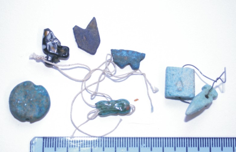 Image for: Fragments of amulets and an inlay